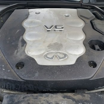 Firestone Complete Auto Care - What appears to be coolant spillage and a poor cleaning attempt - Tires Near Me - Kailua, Hawaii