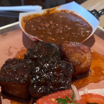 Interstellar BBQ - Peach tea glazed pork belly (bottom) and beans (top) - Barbeque Near Me - Austin, Texas
