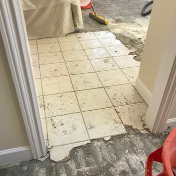 Mission Demolition Floor Removal - Tile partially removed - Demolition Services Near Me