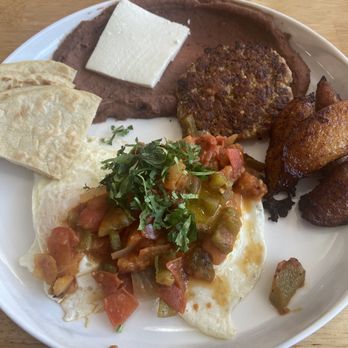 Lucia Middle Island - Huevos rancheros. Eggs, salsa, tortilla, refried beans, cheese, maduros (sweet, fried plantains) - Salvadoran Near Me - Middle Island, New York