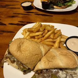 The Narrows - Burger in the background and philly cheesesteak, both were really great! with their goop sauce delicious.