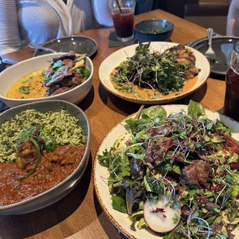 ChopnBlok - Montrose - From left to right, bottom to top: Buka, African Goddess salad, Golden and Aunty Mawa's Maafe - African Near Me - Houston, Texas ChopnBlok - Montrose - From left to right, bottom to top: Buka, African Goddess salad, Golden and Aunty Mawa's Maafe - African Near Me - Houston, Texas