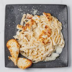 Dream Lounge - Roasted Chicken Fettuccine Alfredo paired perfectly with Garlic Bread.