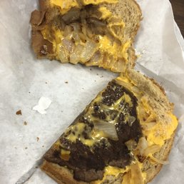 Half of an uneaten patty melt Half of an uneaten patty melt