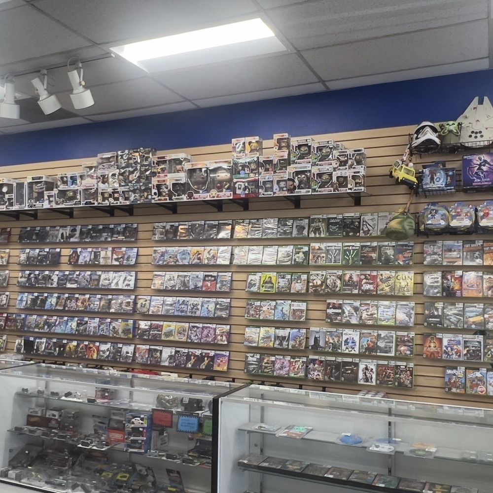 Video Game Geeks - Wide shot of the stores right most game wall and glass cases - Video Game Stores Near Me - Anaheim, California