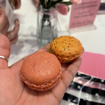 Le Macaron French Pastries - Top is mango macaron and the bottom is raspberry macaron - Coffee & Tea Near Me - Tucson, Arizona