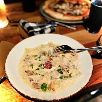 Basso - LEMON RICOTTA RAVIOLI 21 English pea + pancetta + shallot + garlic butter + roasted tomato + white wine + parmigiano - Bars Near Me - Saint Louis, Missouri Basso - LEMON RICOTTA RAVIOLI 21 English pea + pancetta + shallot + garlic butter + roasted tomato + white wine + parmigiano - Bars Near Me - Saint Louis, Missouri