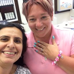 My fiancée along with Kanchan, one of the owners, and her new ring.
