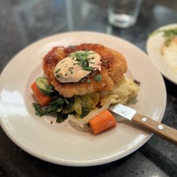 Crumbs - "Brentosaurus" chicken - breaded with bread crumbs and parmesan cheese topped with a spicy aioli and topped on mashed potatoes.