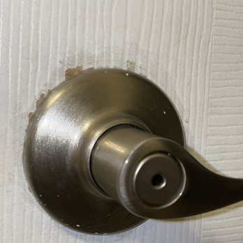 Harlem Property Re+Development - Chipped/unpainted around the doorknob they installed. Splattered paint on the actual knob. - General Contractors Near Me - New York, New York