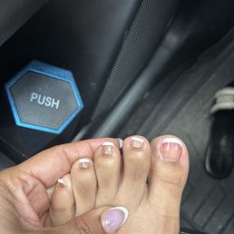 the white tip is not even and in trying to fix it the lady removed the pink polish from underneath. now the toes don't even match. the white tip is not even and in trying to fix it the lady removed the pink polish from underneath. now the toes don't even match.