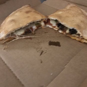 Rocco's Pizza - Cottage Grove - Calzone with sausage, pepperoni, onion and bell peppers - Pizza Near Me - Cottage Grove, Minnesota Rocco's Pizza - Cottage Grove - Calzone with sausage, pepperoni, onion and bell peppers - Pizza Near Me - Cottage Grove, Minnesota