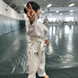 One picture. A thousand emotions. My boy is growing not just in strength, but in heart. Thank you, Gracie University.