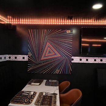 Yop City Resturant - a dining room with a table and chairs - African Near Me - Bronx, New York Yop City Resturant - a dining room with a table and chairs - African Near Me - Bronx, New York