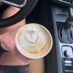 a person holding a cup of coffee a person holding a cup of coffee