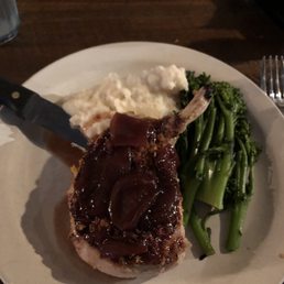 The herb pork chop with garlic mashed potatoes and broccolini