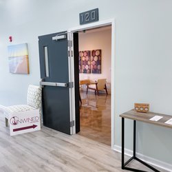 Unwined on the Square - Entrance door inside building 2163 in Harrington Square Apartments