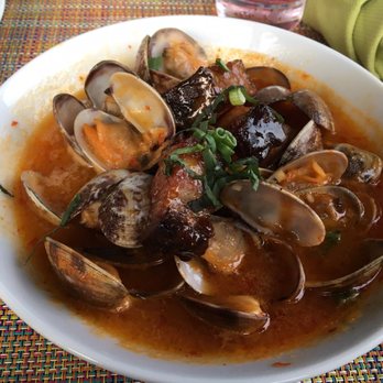 Auberge du Soleil - Mussels with pork belly. Note that it's a sweeter dish due to a couple of ingredients not listed on the menu. We had to return it. - New American Near Me - Rutherford, California