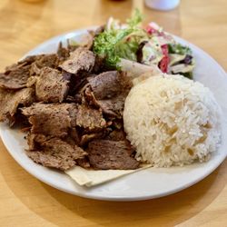 Truva Cafe and Grill - Lamb Gyro/Et Doner - marinated lamb grilled on a rotating vertical spit, served with rice and salad