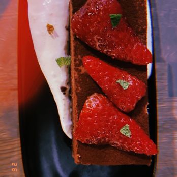 Lenoir - chocolate lisbon cake glazed fresh strawberries, roasted strawberry whip cream - New American Near Me - Austin, Texas Lenoir - chocolate lisbon cake glazed fresh strawberries, roasted strawberry whip cream - New American Near Me - Austin, Texas