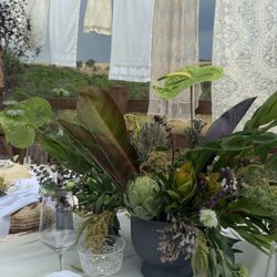 The most whimsical setting for this green arrangement!