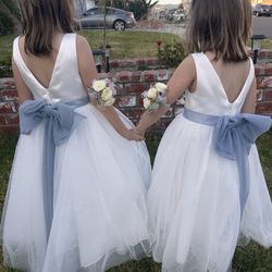 Lompoc Valley Florist - Two white rose corsages, wristlets