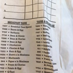Stripes - Code # matches the bacon and egg taco...yet beans were checked off when I only wanted cheese to  be added and there is NO bacon in here.