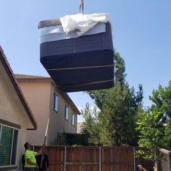 Purple Crane Services - Made it over the house into the backyard. - Crane Services Near Me - Pomona, California