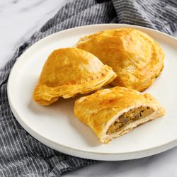 Valerio's Bake Shop - EmpanadValerio's Chicken Empanada a flaky Filipino pastry stuffed with savory well-seasoned chicken fillinga