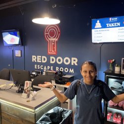 Red Door Escape Room - My sister beside the front desk of the lobby
