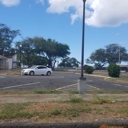 US Post Office - Parking lot with a lot of open spaces.