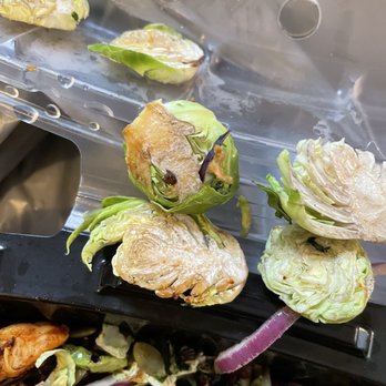 Burger Mojo - lettuce being cut into pieces - Burgers Near Me - College Station, Texas