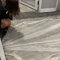 Maya assisting with the veil and paying attention to detail. Maya assisting with the veil and paying attention to detail.
