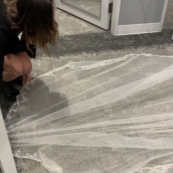 David's Bridal - Maya assisting with the veil and paying attention to detail. - Bridal Near Me - Buford, Georgia David's Bridal - Maya assisting with the veil and paying attention to detail. - Bridal Near Me - Buford, Georgia