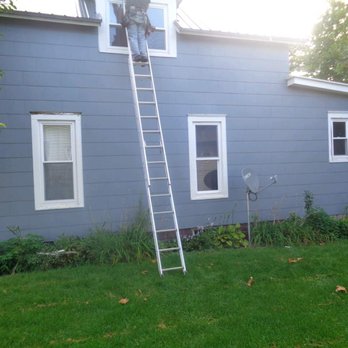 Hoosier Roofing & Construction - a ladder in front of a house - Roofing Near Me Hoosier Roofing & Construction - a ladder in front of a house - Roofing Near Me