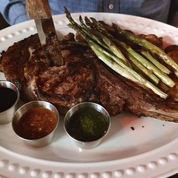 Deluxe Fun Dining - Tomahawk steak. Came with Lobster but we chose to have I on the side - Bars Near Me - Charlotte, North Carolina Deluxe Fun Dining - Tomahawk steak. Came with Lobster but we chose to have I on the side - Bars Near Me - Charlotte, North Carolina