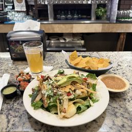Steak fajita salad with chips and salsa Steak fajita salad with chips and salsa