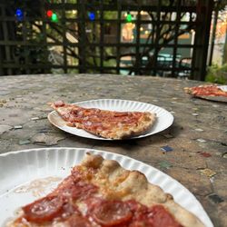 Spiritus Pizza - Pepperoni slices in the outdoor dining area out back