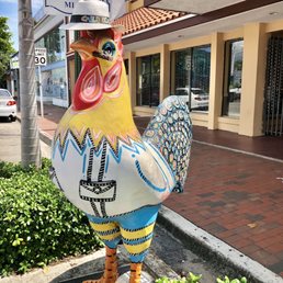 Great photo op..one of the several colorful roosters Great photo op..one of the several colorful roosters