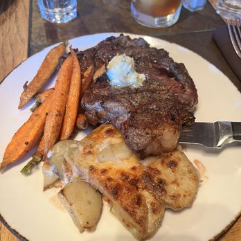 Madison Crossing Lounge - The Ribeye steak with a blue cheese compound butter, roasted carrots, and smoked Gouda au gratin potatoes! It was fantastic - American Near Me - West Yellowstone, Montana Madison Crossing Lounge - The Ribeye steak with a blue cheese compound butter, roasted carrots, and smoked Gouda au gratin potatoes! It was fantastic - American Near Me - West Yellowstone, Montana