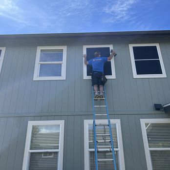 Sunteck Solar Screening - Pat installing the solar screening, primary purpose for these was to save my lawn from being scorched by the sun's reflection. - Shades & Blinds Near Me
