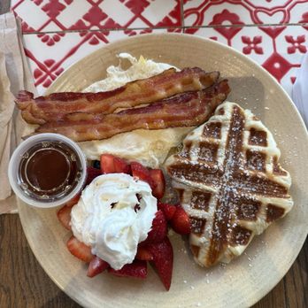 La Panadería - Waffle and med sunny side up. Perfectly cooked eggs and bacon. Fresh fruits with cream. Waffles with syrup. - Breakfast & Brunch Near Me - San Antonio, Texas La Panadería - Waffle and med sunny side up. Perfectly cooked eggs and bacon. Fresh fruits with cream. Waffles with syrup. - Breakfast & Brunch Near Me - San Antonio, Texas