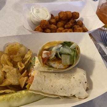 Nelsen's Hall Bitters Pub - Buffalo chicken wrap and sweet potato tots. - American Near Me - Washington Island, Wisconsin Nelsen's Hall Bitters Pub - Buffalo chicken wrap and sweet potato tots. - American Near Me - Washington Island, Wisconsin