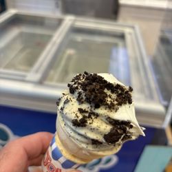 La Diperie - Half eaten, vanilla ice cream dipped in white fudge and topped with Oreo.