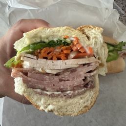 Classic cold cut banh mi. Huge. Hard to eat Classic cold cut banh mi. Huge. Hard to eat