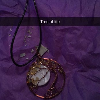 Creative Energy - Love the way they wrap up the necklaces! Some sage and purple paper - Bookstores Near Me - Melbourne, Florida