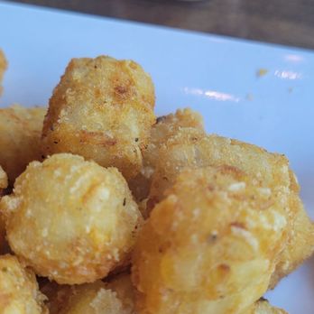 Blazing Onion Burger Company - Tator tots with sauce... in a single use container - American Near Me - Newcastle, Washington
