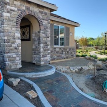 LG Construction - a blue car parked in front of a house - General Contractors Near Me LG Construction - a blue car parked in front of a house - General Contractors Near Me