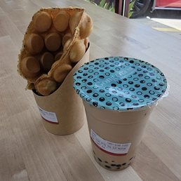 Earl grey milk tea with 3JS at 50% sugar and bubble waffle Earl grey milk tea with 3JS at 50% sugar and bubble waffle