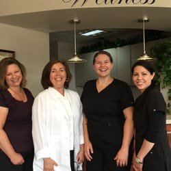 Elmbrook Chiropractic - Meet the staff! From left to right: Katie (office business assistant), Dr. Settimi, Tara (office manager), and Jen (chiropractic assistant)